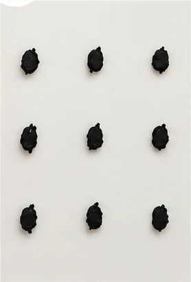 Evenly spaced separate mounds of mastic on a white surface